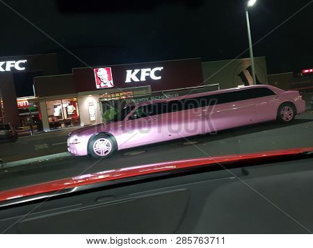 Velbert, Nrw, Germany - November 17, 2018:
A Pink Stretch Limousine Waits For The Arrival Of Passeng