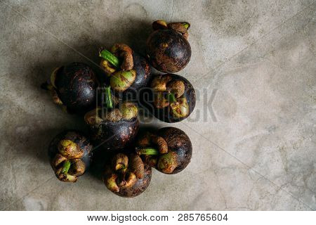 Fresh Mangostine. Fresh Tropical Fruits. On A Grey Background. Top View.