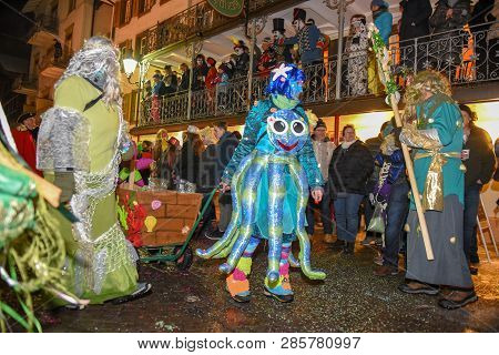 Participants In Costumes Perform A Street Procession At The Carnival