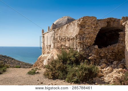 Small Abandoned Mosque / Chapel On The Top Of A Cliff At The Atlantic Ocean Coastline. Dark Blue Wat