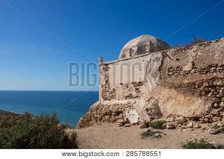 Small Abandoned Mosque / Chapel On The Top Of A Cliff At The Atlantic Ocean Coastline. Dark Blue Wat
