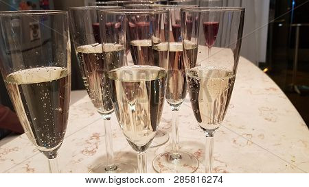 Glasses With Sparkling Vine On A Table In The Bar