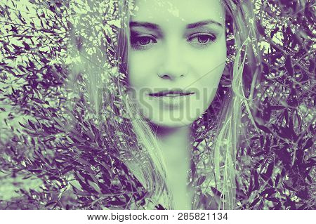 Double Exposure Duotone Female Close Up Portrait With Dreamy Olive Tree Leaves