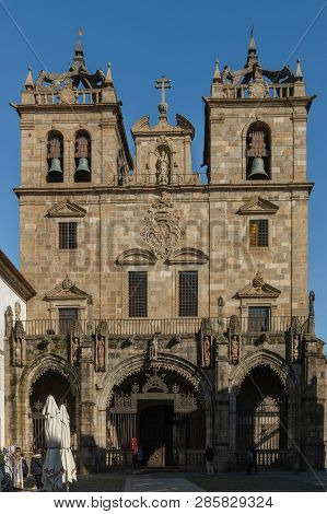 Braga, Portugal - Circa February 2019: Braga Cathedral With Its Gothic Bell Towers. Se De Braga Is T