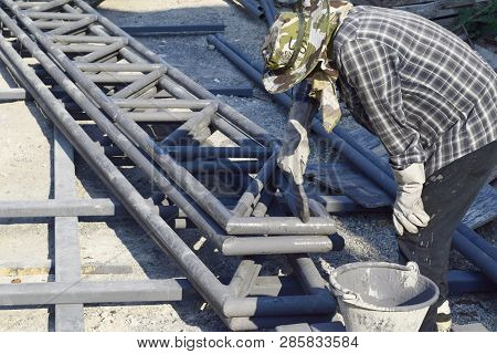 The Technicians Are Painting Rustproof Steel Roof Structures.