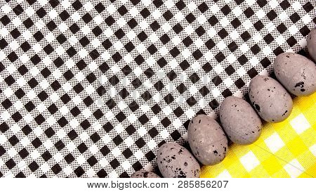 Easter Abstract Gift Card On Black And White Textured Background With Easter Eggs  Laying In Row