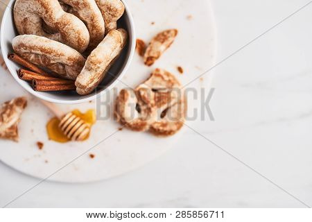 Traditional Chtristmas Gingerbread Cookies Made Of Ginger, Honey And Cinnamon With Icing In White Bo