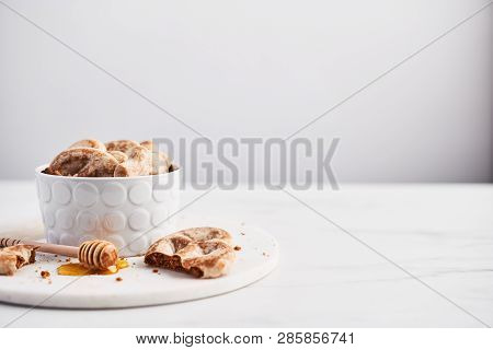 Traditional Chtristmas Gingerbread Cookies Made Of Ginger, Honey And Cinnamon With Icing In Bowl On 