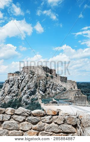 Famous Castle Devin With Blue Cloudy Sky. Slovakia, Central Europe. Teal And Orange Photo Filter.