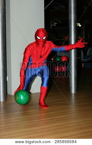 Kiev, Ukraine, 08.09.2008 A Man In A Costume Of Spiderman Is Throwing A Ball Indoors Of The Club Bow