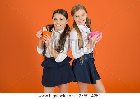 Girls Kids School Uniform Orange Background. Schoolgirl Hold Mug. School Lunch. Having Break Relax. 