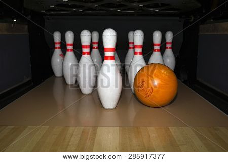 Skittle And Bowling Ball On Wooden Bowling Alley. Pinsetter