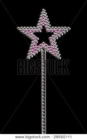 Sølvfarvede tryllestav isoleret på sort baggrund