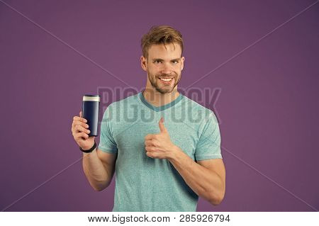 Happy Man Show Thumbs Up With Gel Bottle On Violet Background. Bearded Man Like Shampoo Tube On Purp