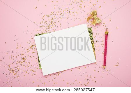 Blank Sheet Of Paper, Notebook On A Festive Pink Background With Golden Confetti And Glitter. Univer