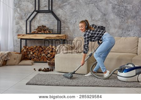 Full Length Portrait Of Cheerful Young Woman 20s Listening To Music Via Headphones And Having Fun Wi