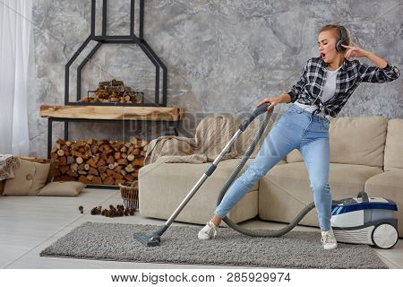 Full Length Portrait Of Cheerful Young Woman 20s Listening To Music Via Headphones And Having Fun Wi