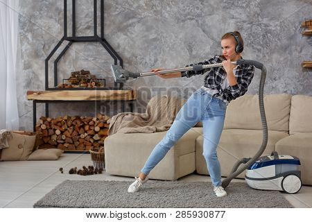 Full Length Portrait Of Cheerful Young Woman 20s Listening To Music Via Headphones And Having Fun Wi