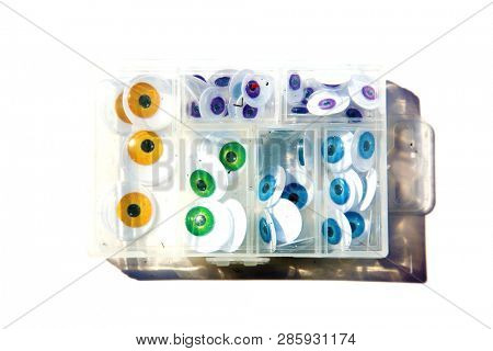 Googly Eyes. Colorful Googly eyes in a package. Isolated on white. Room for text.