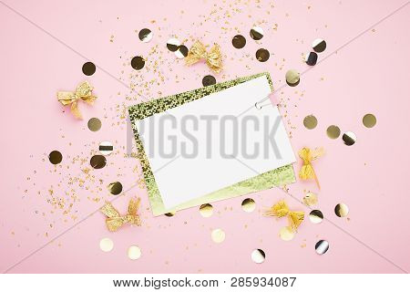 Blank Sheet Of Paper, Notebook On A Festive Pink Background With Golden Confetti And Glitter. Univer