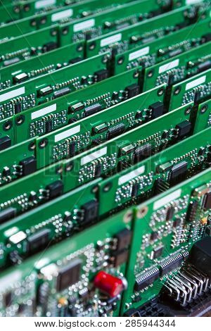 Microelectronics Industry And Manufacturing. Stack Of Produced  Printed Circuit Boards With Surface 
