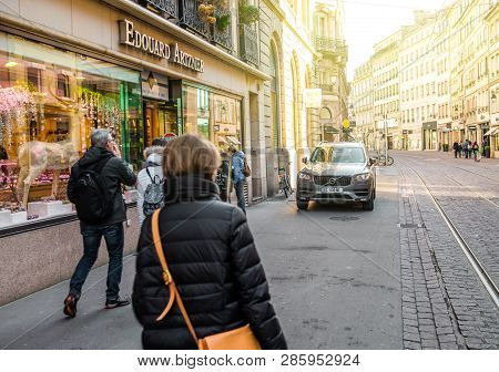 Strasbourg, France - Feb 16, 2018: People Walking Early In The Morning On Rue De La Mesange Near Bou