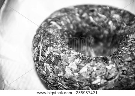 Chinese Pressed Puer Tea On Wrapping Paper, Close-up, Macro