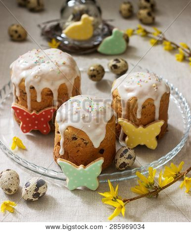 Easter Composition Of Easter Cakes, Biscuits, Eggs And Forsythia Flowers. Rustic Style.
