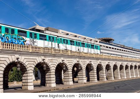 Paris, France - September 8, 2018: Metro Crossing Bercy Bridge With French Ministry For The Economy 