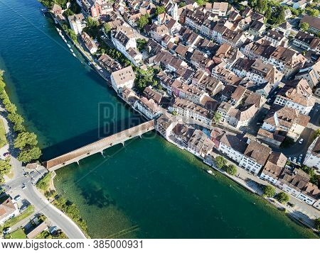 Aerial Image Of Swiss Old Town Diessenhofen With Old Wooden Covered Bridge Over The Rhine River, Can