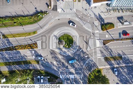 Aerial View Of The Roundabout. The Cars Moving On The Roundabout. The Modern Design Of A Street In F
