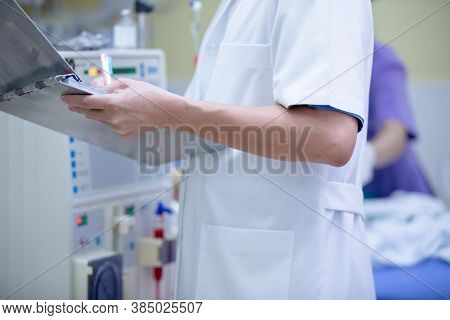 The Specialist Are Doing Continuous Renal Replacement Therapy Equipment And Injection Pump.