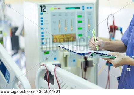 The Specialist Are Checking Continuous Renal Replacement Therapy Equipment And Injection Pump And He
