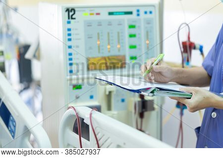 The Specialist Are Checking Continuous Renal Replacement Therapy Equipment And Injection Pump And He