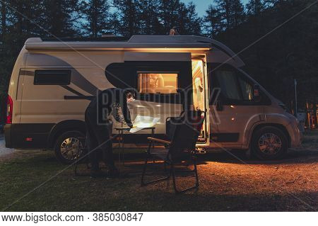 Caucasian Men In His 40s Browsing Local Map In Front Of His Rv Recreational Vehicle Camper Van Durin