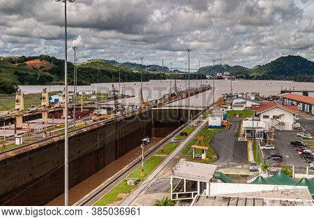 City Of Knowledge, Panama - November 30, 2008: Miraflores Locks. Brown Water Lake Between Different 