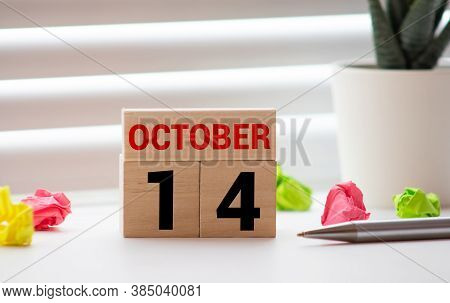 October 14st. Day 14 Of Month, Daily Calendar On White Table With Reflection, With Light Blue Backgr