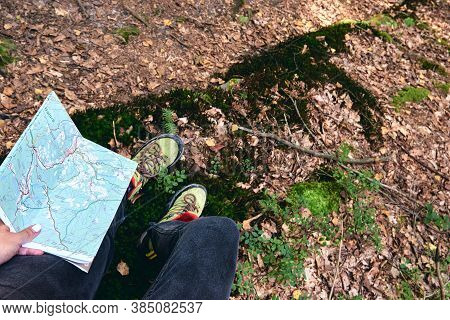 Hiking Boots In Outdoor Action. Top View Of Boot On The Trail. Close-up Legs In Jeans And Sport Trek