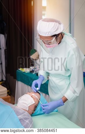 Asian Woman Eyebrow Tattooing By Specialist In Eyebrow Tattoo Or Embroidery Clinic Use Covid-19 Prev