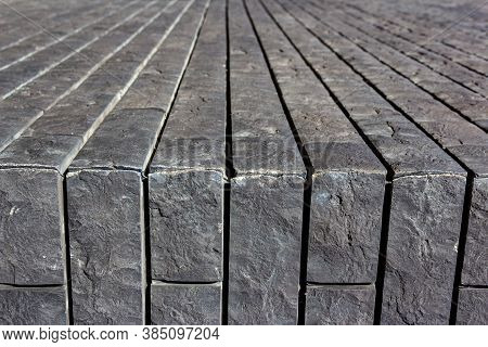 Horizontal Surface Made Of Gray Tiles That Imitate Brickwork. Modern Finishing Material. The Gray Fa
