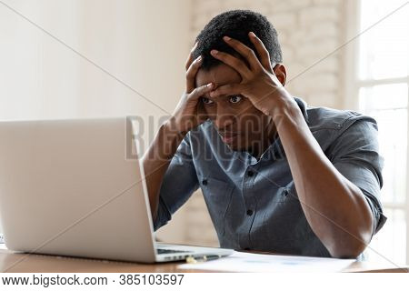 Angry Biracial Male Employee Annoyed With Laptop Operational Problems