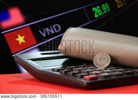 Two Hundred Vietnam Dong Coin On Obverse (vnd) On Black Calculator And Wallet On Red Floor With Digi