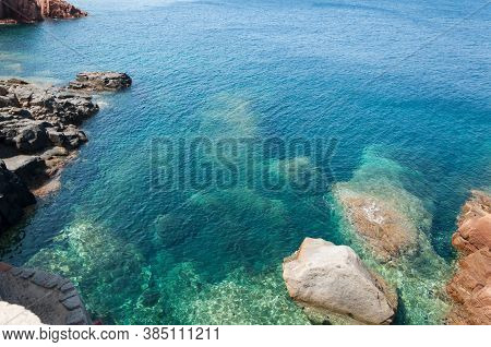 Sardinia Coastline: Typical Red Rocks And Cliffs Near Sea In Arbatax; Italy