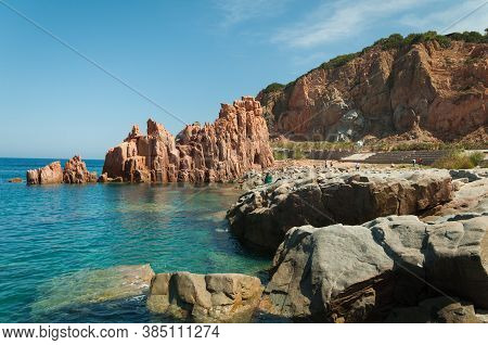 Sardinia Coastline: Typical Red Rocks And Cliffs Near Sea In Arbatax; Italy