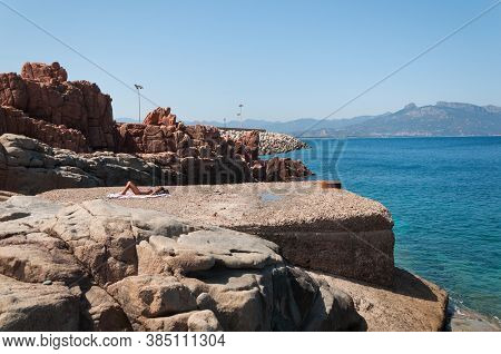 Sardinia Coastline: Typical Red Rocks And Cliffs Near Sea In Arbatax; Italy