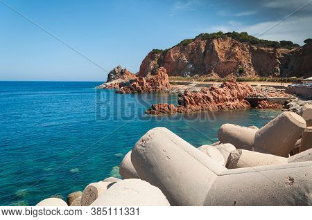 Sardinia Coastline: Typical Red Rocks And Cliffs Near Sea In Arbatax; Italy