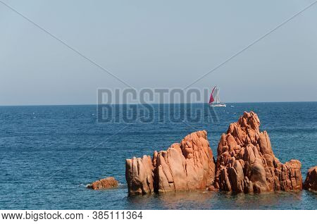 Sardinia Coastline: Typical Red Rocks And Cliffs Near Sea In Arbatax; Italy