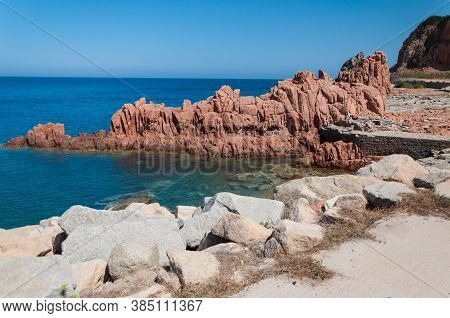Sardinia Coastline: Typical Red Rocks And Cliffs Near Sea In Arbatax; Italy