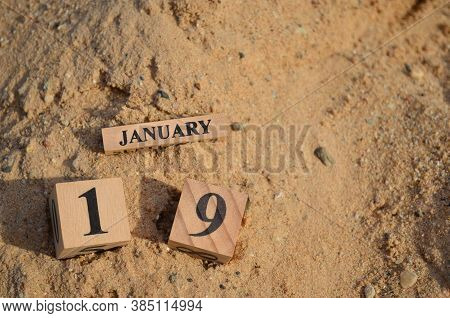 January 19, Number Cube With A Sand Background.