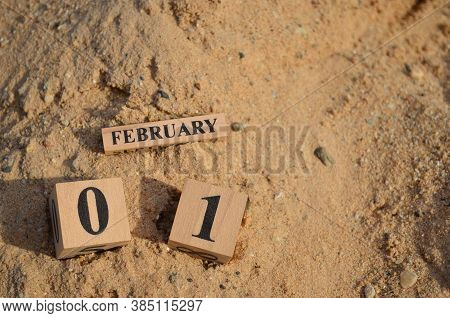 February 1, Number Cube With A Sand Background.